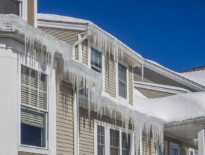 House with extensive ice dam formations