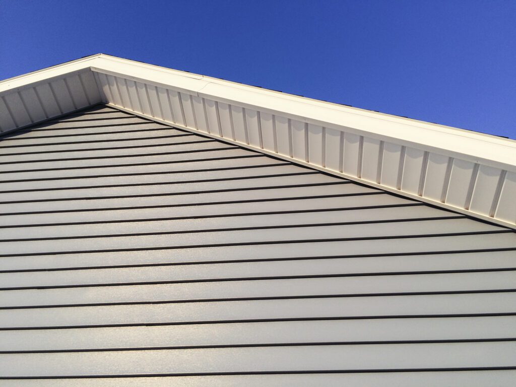 Suburban home with long-lasting vinyl siding installed by Contractor in PA