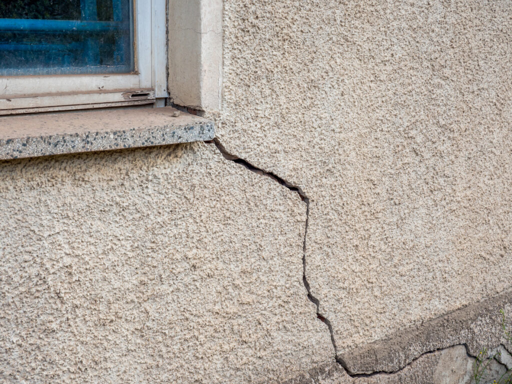 Damaged stucco with cracks and other deformities can lead to structural damage